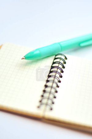 Photo for Close-up view of pen and notebook on light background - Royalty Free Image
