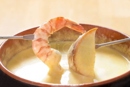 Photo for Close up view of delicious cheese fondue with  shrimp - Royalty Free Image