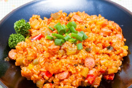 Photo for Tasty takikomi rice with vegetables and sausages - Royalty Free Image
