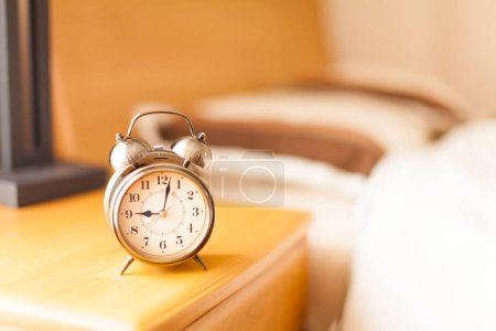 Photo for Classic Alarm Clock On Table - Royalty Free Image