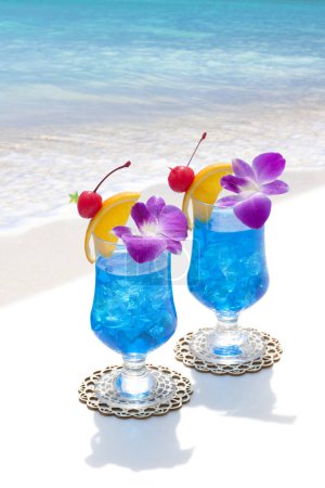 Photo for Two glasses with cocktails on a tropical beach - Royalty Free Image