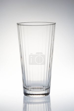 Photo for Close-up view of empty glass on grey background - Royalty Free Image