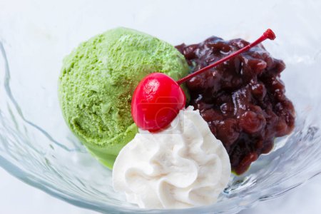 Photo for Green and red ice cream with green cherry - Royalty Free Image