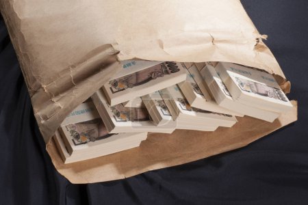 Photo for Japanese currency, pile of yen banknotes in paper bag - Royalty Free Image