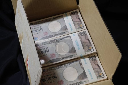 Photo for Japanese yen banknotes in cardboard box - Royalty Free Image