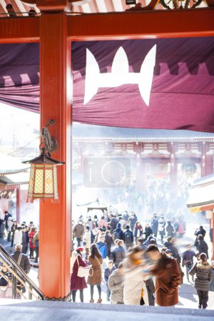 Photo for Many visitors gathered at an ancient Japanese shrine during a holiday - Royalty Free Image