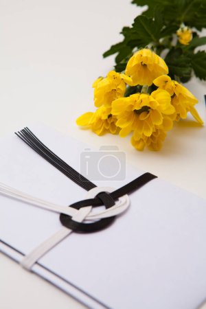Photo for Japanese envelop for funeral with yellow flowers - Royalty Free Image