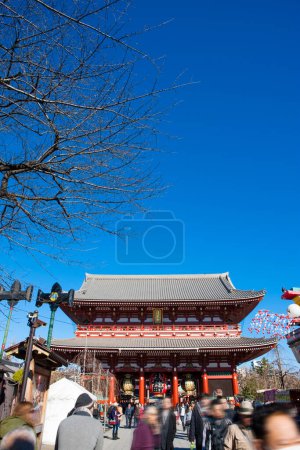 Photo for Crowd of visitors at ancient Japanese shrine during holiday - Royalty Free Image