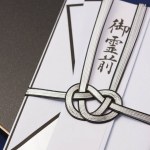 Japanese envelop for funeral on background, close up