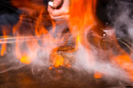 Photo for Fire and hot coals on background, close up - Royalty Free Image