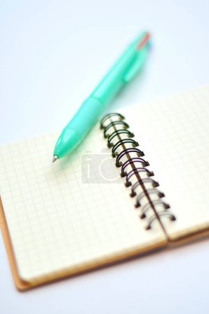 Photo for Close-up view of pen and notebook on light background - Royalty Free Image