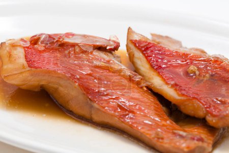 fried redfish (sebaste) on plate, close up