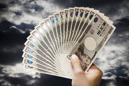 Foto de Mano de dinero del yen japonés en el fondo, de cerca - Imagen libre de derechos