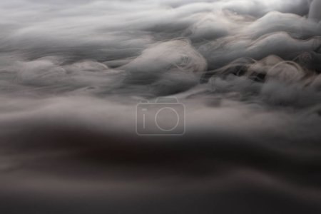 Photo for White smoke clouds on a dark background. - Royalty Free Image