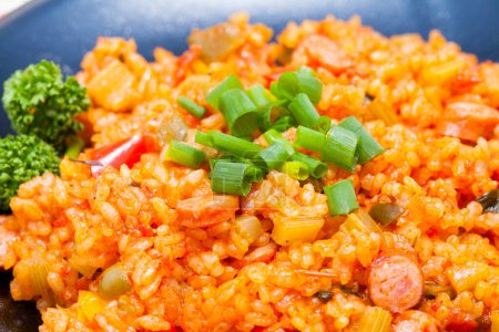 Photo for Tasty takikomi rice with vegetables and sausages - Royalty Free Image