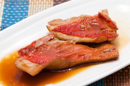 fried redfish (sebaste) on plate, close up