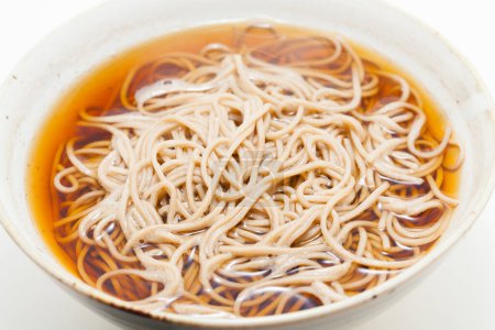 Photo for Chinese noodles with soy sauce in a white bowl. - Royalty Free Image