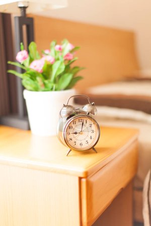 Photo for Classic Alarm Clock On Table - Royalty Free Image