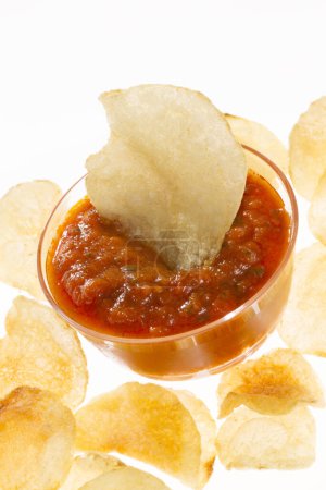 Photo for Fried chips with chili sauce  on background, close up - Royalty Free Image