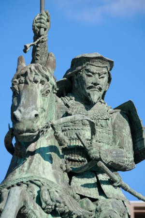 statue of hojo soun in japan on background