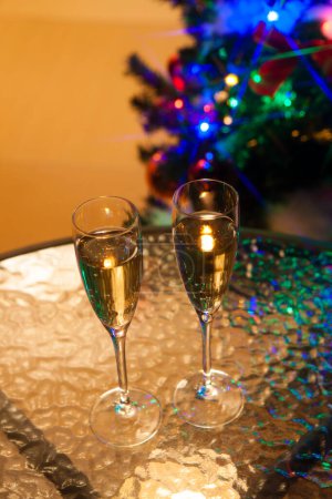 Photo for Glasses of champagne on table and festive background - Royalty Free Image