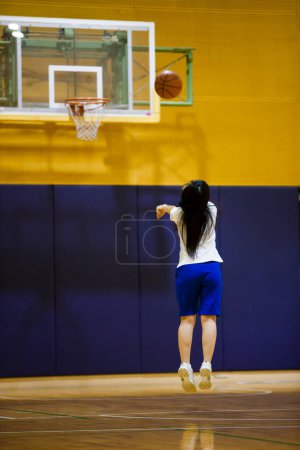 Photo for Beautiful asian girl  playing on basketball court - Royalty Free Image