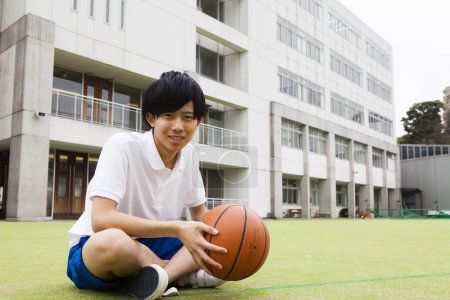 Photo for Portrait of young asian man playing basketball - Royalty Free Image