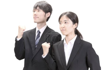 Photo for Successful asian businessman and businesswoman with fists raised on white background - Royalty Free Image