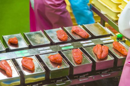 Photo for Close-up view of fresh fish fillet on silver trays in the local market in Japan - Royalty Free Image