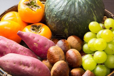 Photo for Harvest concept background with fresh tomatoes, potatoes, grape berries and green pumpkin - Royalty Free Image
