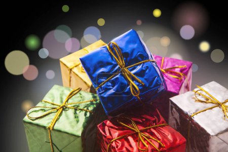 Photo for Pile of colorful gift boxes, decorated with ribbons, Christmas card background - Royalty Free Image