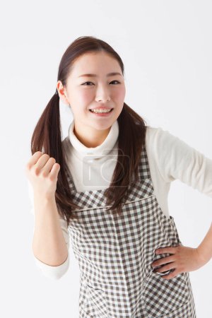 Photo for Portrait of beautiful young japanese woman in checkered dress on white background - Royalty Free Image