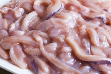 Photo for Bowl of raw squid tentacles ready for cooking - Royalty Free Image
