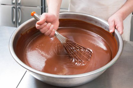 Photo for Man whisking chocolate in a bowl - Royalty Free Image