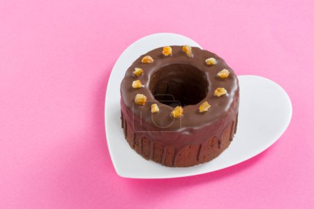 Photo for Chocolate donut on a heart shaped plate - Royalty Free Image