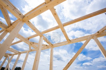 Photo for New house under construction, wooden beams against blue sky - Royalty Free Image