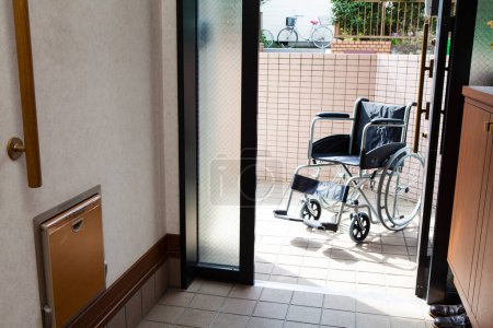 Photo for Empty wheelchair in modern house interior - Royalty Free Image