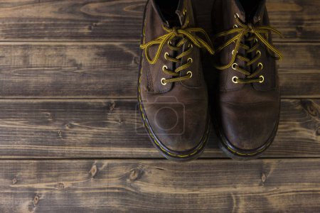 Photo for Brown leather shoes on wooden floor - Royalty Free Image