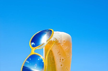Photo for Beer glass with the sunglasses - Royalty Free Image