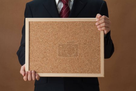 Photo for Cropped photo of businessman holding blank frame with copy space for message - Royalty Free Image