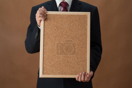 Photo for Cropped photo of businessman holding blank frame with copy space for message - Royalty Free Image