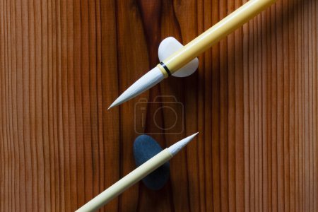 Photo for Close-up view of a white brushes on the wooden background - Royalty Free Image