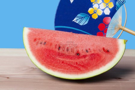 Photo for Slice of fresh red watermelon on wooden table - Royalty Free Image