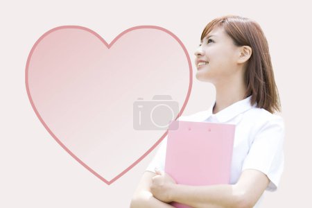 Photo for Woman with a pink heart shape - Royalty Free Image