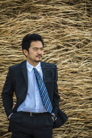 young asian businessman in formal wear 