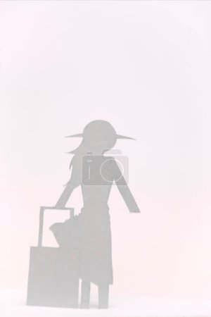 Photo for Silhouette of woman made from paper isolated on pink background - Royalty Free Image
