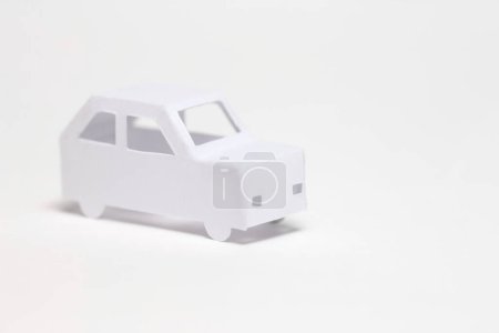 Photo for A toy car made of paper on a white background - Royalty Free Image