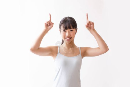 Photo for Beautiful asian woman posing in yoga studio - Royalty Free Image