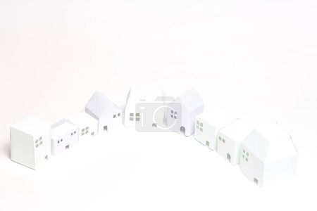 Photo for White paper houses on a white background - Royalty Free Image