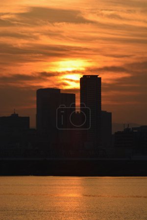 Photo for Beautiful sunset view of the city and reflection in water - Royalty Free Image